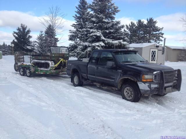 8x8 on trailer with truck
